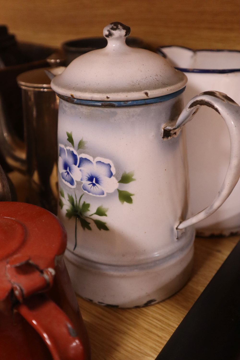 Assorted decorative objects including metalware, books, etc.